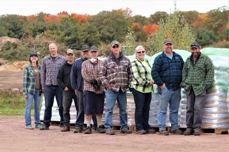 Group photo of the Hsu Growing Supply team dressed in flannel/plaid for Plaidurday